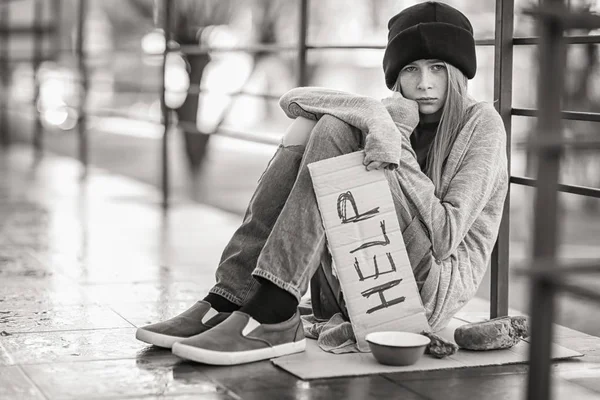 depositphotos_187503246-stock-photo-homeless-poor-teenage-girl-holding